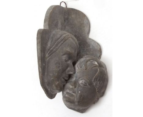 Lead corner bracket formed as mother and child masks, signed H Busow?, 38cms drop  