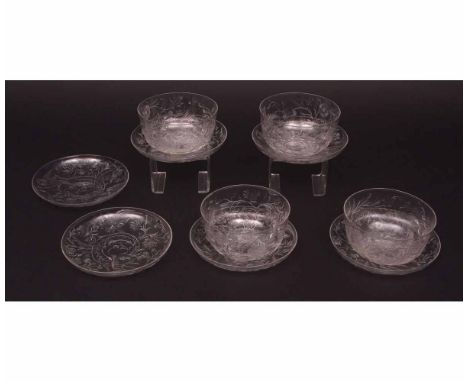 Set of four decorative finely engraved glass finger bowls and six saucers, engraved with game birds and foliage etc, circa ea