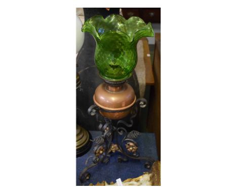 Arts & Crafts stylised oil lamp with a twisted metal base, coppered and brass centred flowers with a brass font, crimped gree