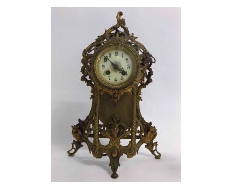 Late 19th century brass mantel timepiece with Arabic chapter ring, 41cms high  