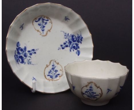 Worcester  Dry blue  teabowl and saucer, square marks with sprays of formal flowers contained within gold rococo cartouches, 