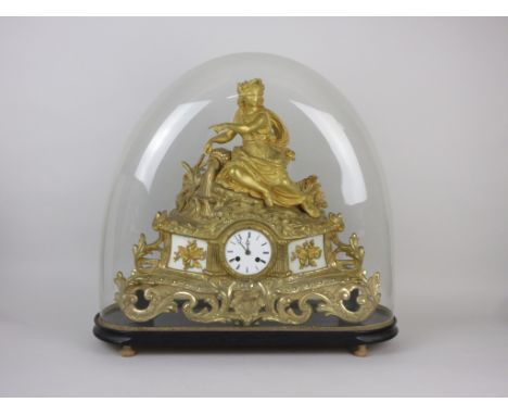 A large French gilt metal Mantel Clock with female figure surmount above a circular dial, under glass dome and on stand, 19in