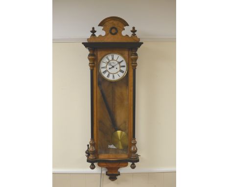 A 19th Century Vienna Wall Clock with circular white enamel dial, double weight driven movement, in glazed case