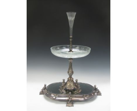 A Victorian plated Epergne with platform base having bevelled mirror and cherub supports, baluster column supporting etched g