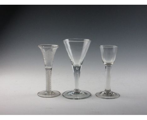 Three Georgian Wine Glasses, comprising a Jacobean style wine with double series opaque twist and rose/butterfly engraved bel