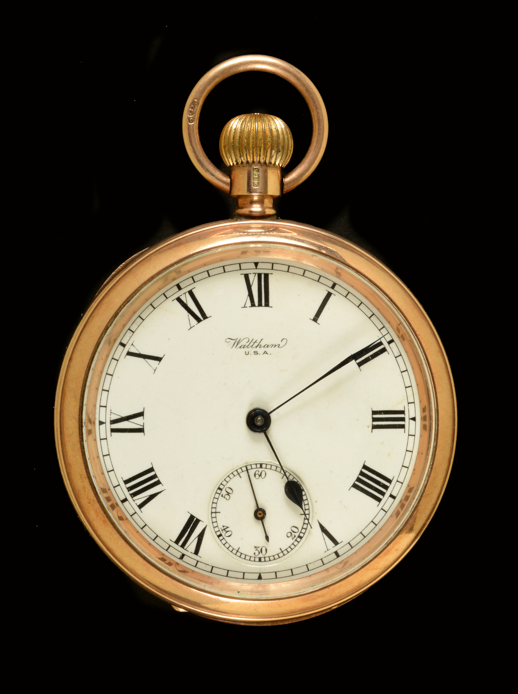 An open faced 9ct gold cased Pocket Watch by Waltham, the white enamel