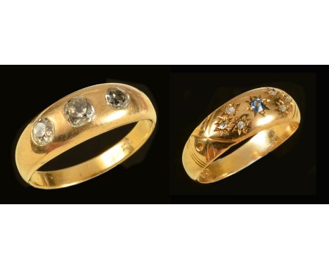 A Diamond three stone Ring gypsy-set old-cut stones, stamped 18ct, ring size U, a Sapphire and Diamond Ring pavé-set round sa