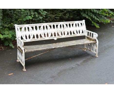 A Victorian Coalbrookdale cast iron Garden Bench with design by Christopher Dresser with rosette design, 6ft 4in