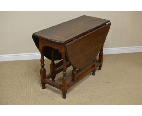 An early 18th Century oak oval Gate-leg Table fitted one drawer on baluster turned and square supports, square stretchers, 3f