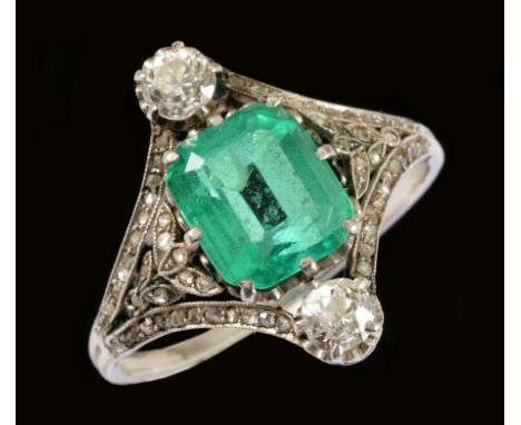 An early 20th Century Emerald and Diamond Ring claw-set step-cut emerald, estimated 2cts, between two old-cut diamonds in int