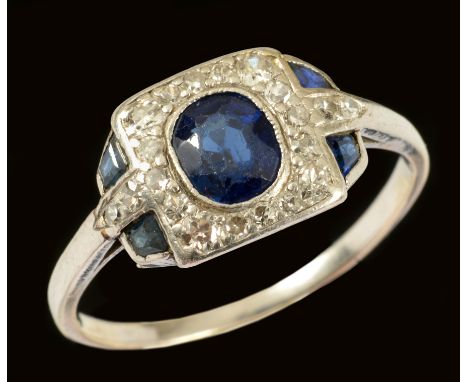 An Art Deco Sapphire and Diamond Cluster Ring millegrain-set oval-cut sapphire within square frame of pavé-set eight-cut diam