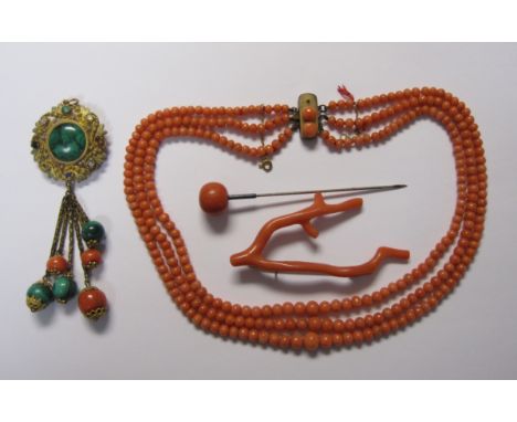 A three strand Coral Bead Necklace on gilt metal clasp set coral (one bead missing), a Coral branch Brooch, a Hat Pin with co