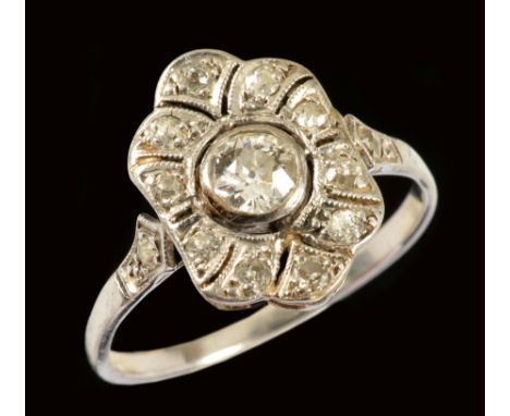 An early 20th Century Diamond Cluster Ring, the openwork lozenge shaped plaque millegrain-set old-cut stones, ring size Q 1/2