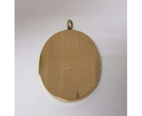A large oval Locket with engine turned decoration enclosing portrait miniature, stamped 9c, 2in, approx 22gms