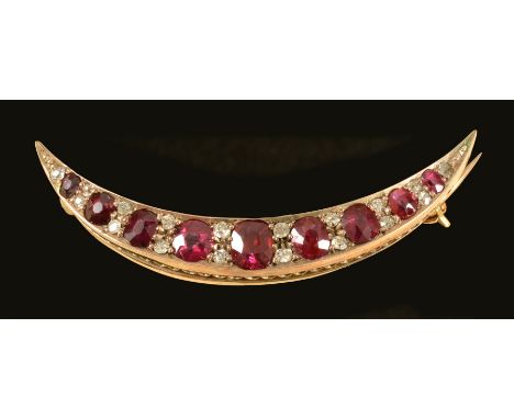 A Ruby and Diamond Crescent Brooch pavé-set graduated cushion-cut rubies interspersed with pairs of old-cut diamonds