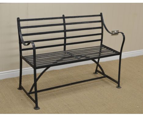 A Regency style black painted wrought iron Garden Bench with slatted seat, 4ft