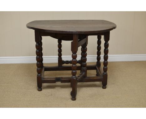 A late 17th Century oak circular Gate-leg Table on bobbin turned supports united by square stretchers, 3ft 2in