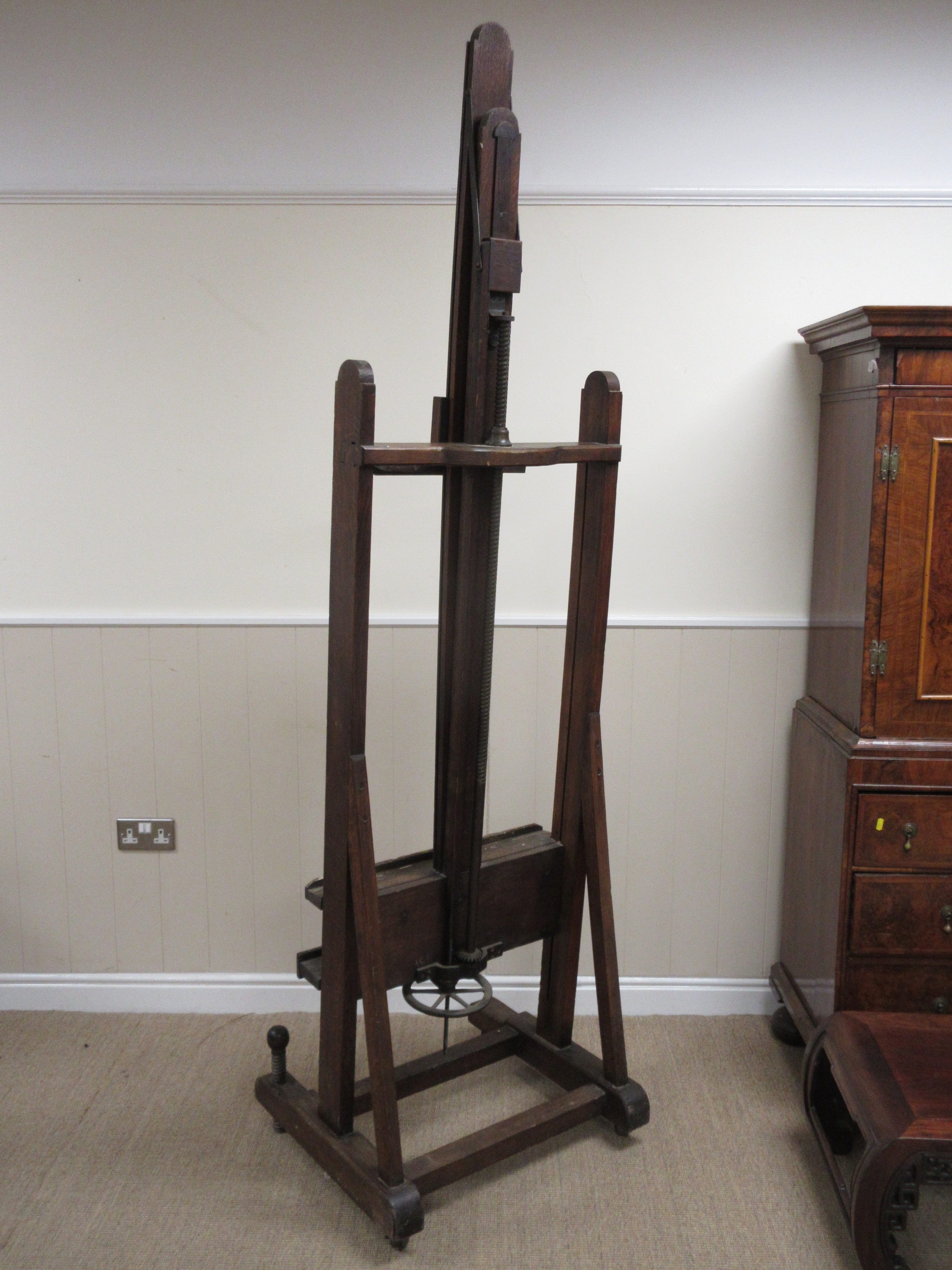 A Victorian large oak Easel with hand crank adjustable mechanism and