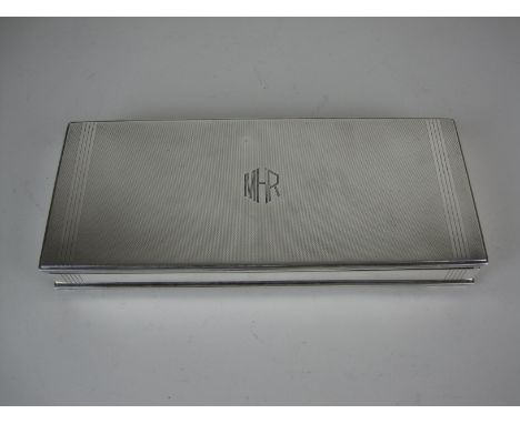 A George VI silver Art Deco Cigarette Box with engine turning and initials M.H.R., London 1937, Goldsmiths &amp; Silversmiths