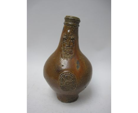 A 17th Century Bellarmine Flask with mask spout and stylised rosette and star roundel, 9in