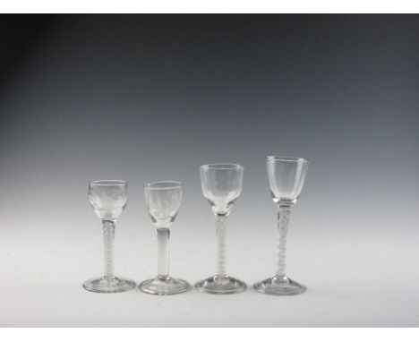 Four Georgian Wine Glasses, comprising a short double series opaque twist cordial with engraved snowdrop rounded bowl,; a sho