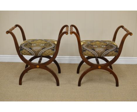 A pair of 19th Century inlaid mahogany X-frame Stools, the turned armrests on swept supports above stuff over seats, the curv