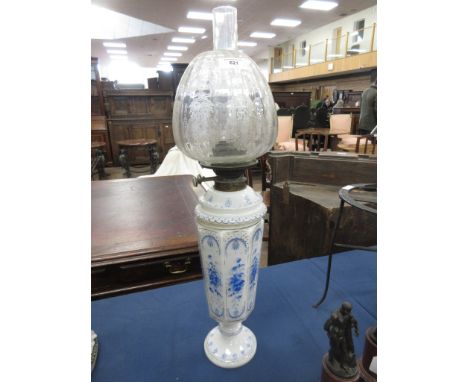 A Victorian opaque glass Oil Lamp with blue floral painted panels, Duplex fitting and etched clear glass shade