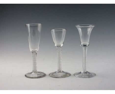 Three Georgian Wine Glasses, comprising a glass with double series opaque twist stem and conical bowl, a double series cordia