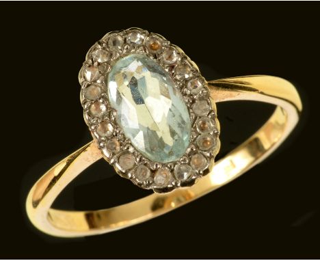 An Aquamarine and Diamond Cluster Ring set oval-cut aquamarine within frame of rose-cut diamonds, stone deficient, ring size 