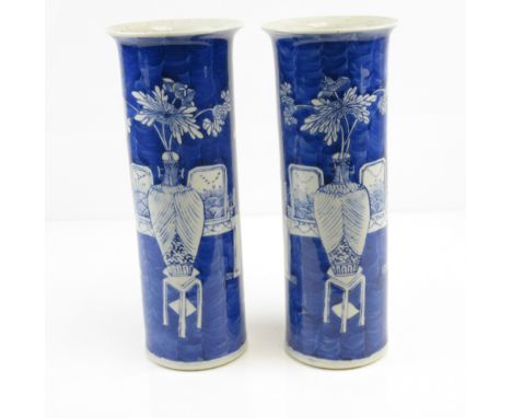 A pair of Chinese blue and white sleeve Vases, painted with vases of flowers and antiqius, 4-character Kangxi marks, 11 3/4 i