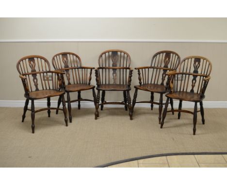 Five 19th Century near matching Windsor Armchairs in ash and elm, etc, with pierced splat and stick backs, solid seats on tur