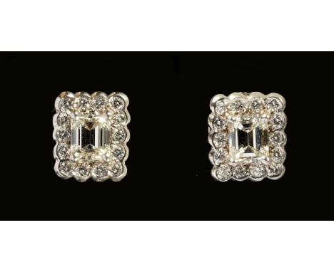 A pair of Diamond Cluster Earrings each claw-set step-cut stone, approx 0.50cts, within rectangular frame of brilliant-cut st