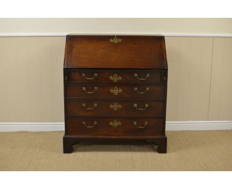 A George III mahogany Bureau with well fitted interior of small drawers, pigeon holes, door, etc, four long graduated drawers
