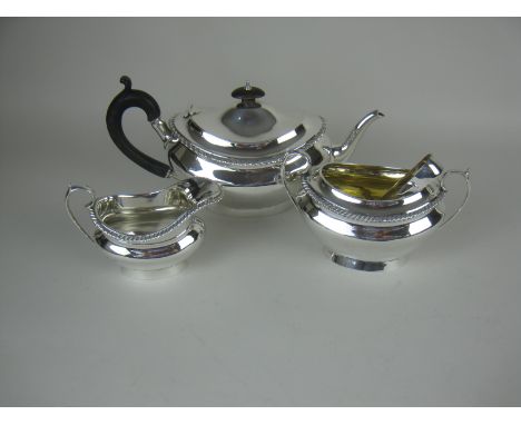 A George V silver three piece Tea Service of oval form with gadroon rims, London 1927/8