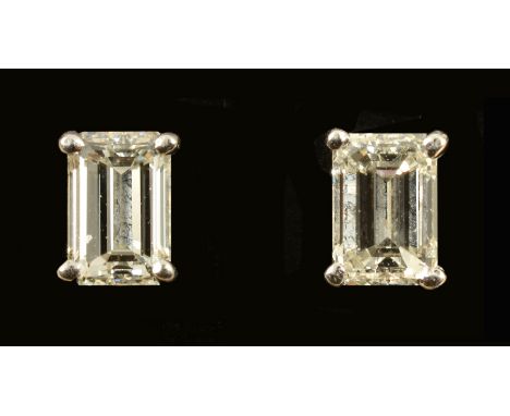 A pair of Diamond Ear Studs each corner claw-set step-cut stone in 18ct white gold, estimated total diamond weight 0.70cts