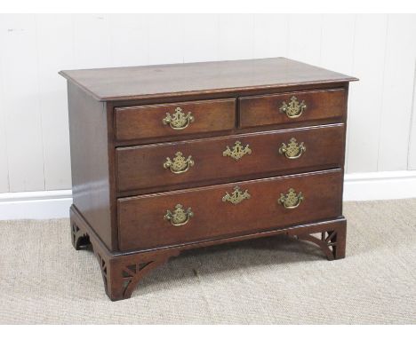A late 18th Century oak Chest of small proportions fitted two short and two long drawers mounted upon pierced bracket feet 2f