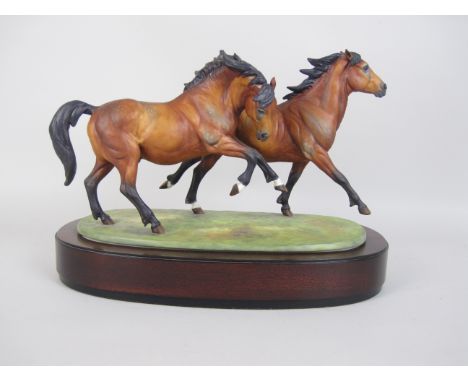 A Royal Worcester Limited Edition Equestrian Model "Galloping Ponies" modelled by Doris Lindner on wooden base, accompanied b