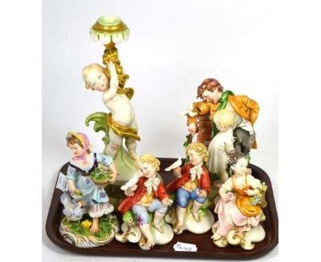 Five Capodimonte figures together with a similar candlestick