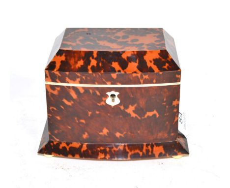 A regency tortoiseshell tea caddy, of bowfront form, the hinged cover containing two lidded compartments, with flared apron a