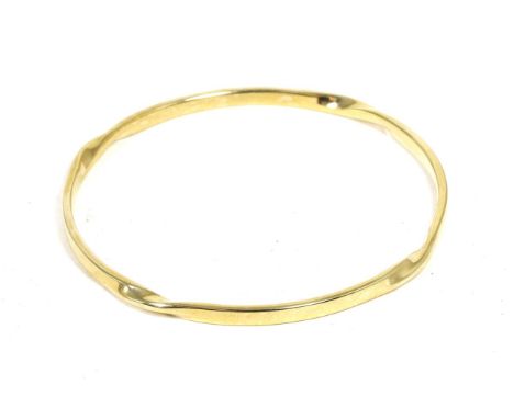 A 9 carat gold twist motif bangle, measures 6.5cm in diameter Good condition. 17.8g