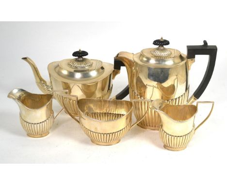 A Georgian style silver five piece tea set, by J S & S, Sheffield 1931, comprising a tea pot, water pot, sucrier and two crea