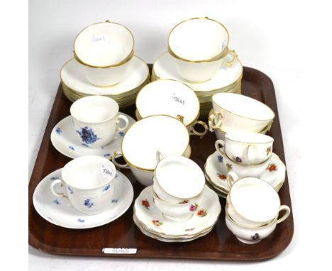 A pair of Nymphenburg hand painted coffee cups and saucers, blue floral decoration, moulded detail, stamped; together with si