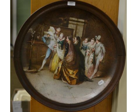 A large ceramic plaque depicting an interior figural scene, oak frame 