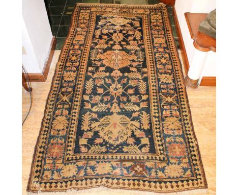 Oriental carpet 20th centurydecorated with floral and plant patterns, defects206x116 cm.