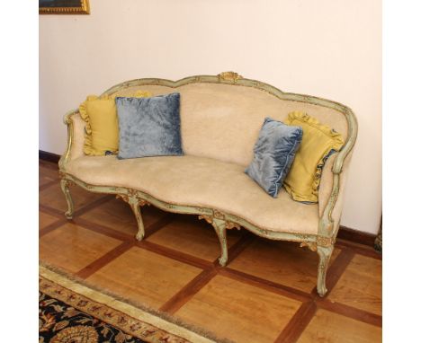 Lacquered and golden wood sofa Italy, XVIII century.shaped structure decorated with polychrome vegetal and volute motifs, fab