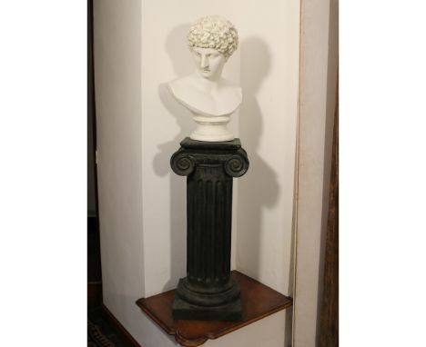 Biscuit head depicting Antinous Italy, 20th centuryresting on a painted plaster column136x38x37 cm.