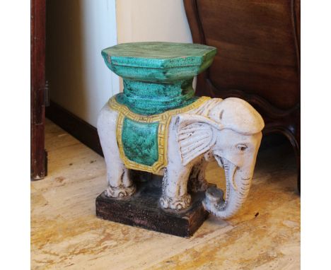 Ceramic bases Italy, 20th centurydecorated in shades of white and green, depicting an elephant48x50x24 cm.