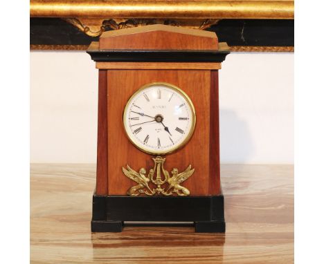 Wooden table clock Italy, 20th centurydecorated with bronzes chiseled with Empire-style motifs, ebanized wooden base30x20x11 
