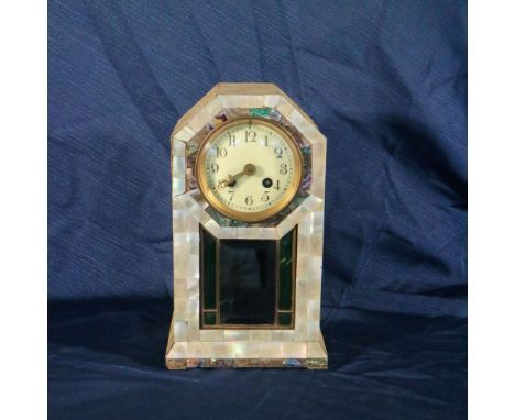 Watch covered in mother-of-pearl 20th centuryarchitectural shape structure centered by dial with Arabic numerals33x16x18 cm.