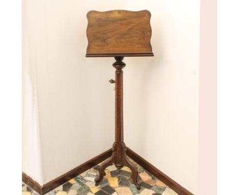 Walnut lectern Italy, 19th centuryresting on hexagonal stem with tripod terminal135x45x28 cm.